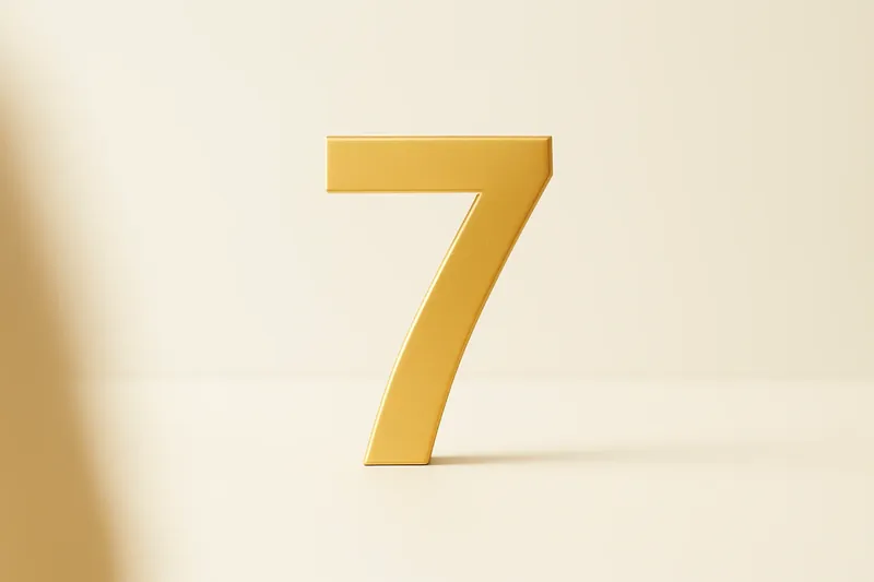 Single large golden seven symbol on cream background with soft shadow